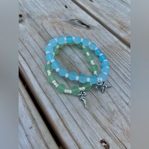 Two Fairy theme bracelets, both with charms. Same size, Blue and Green